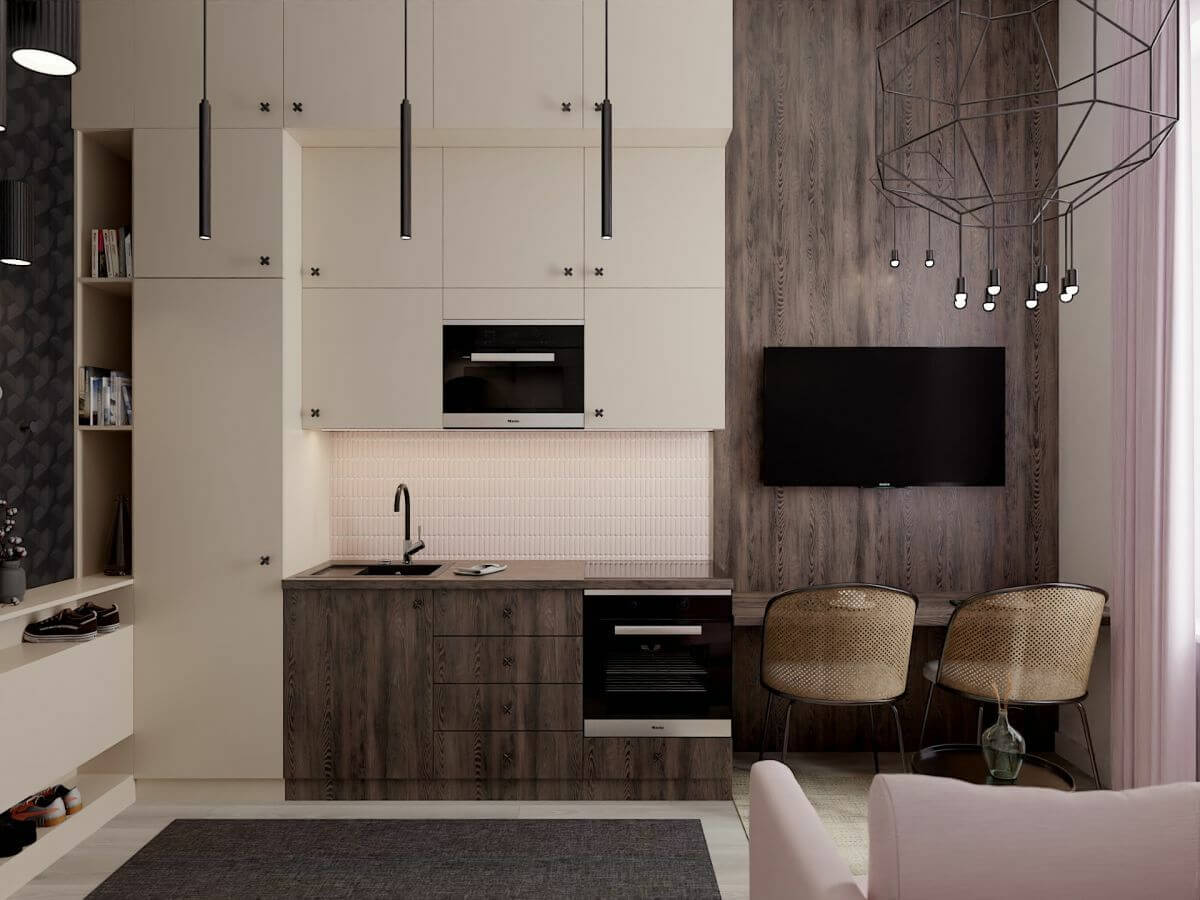 Púder rózsaszín, krémes árnyalatok és modern egyedi konyha egy 22 m2-es budapesti lakásban